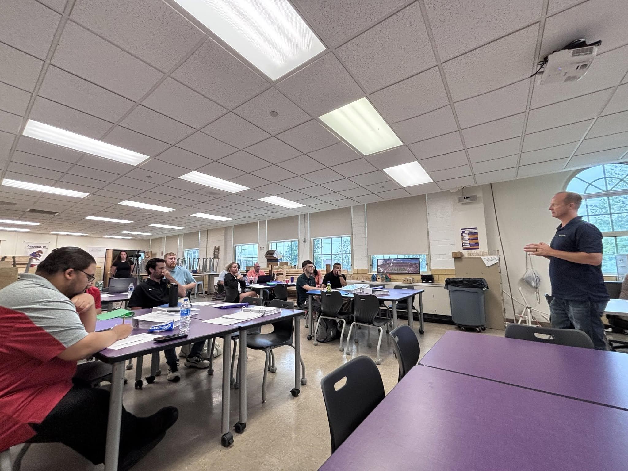 Northern Kentucky educators seated at classroom tables during a two-day TradesNKY professional development session as an industry leader presents