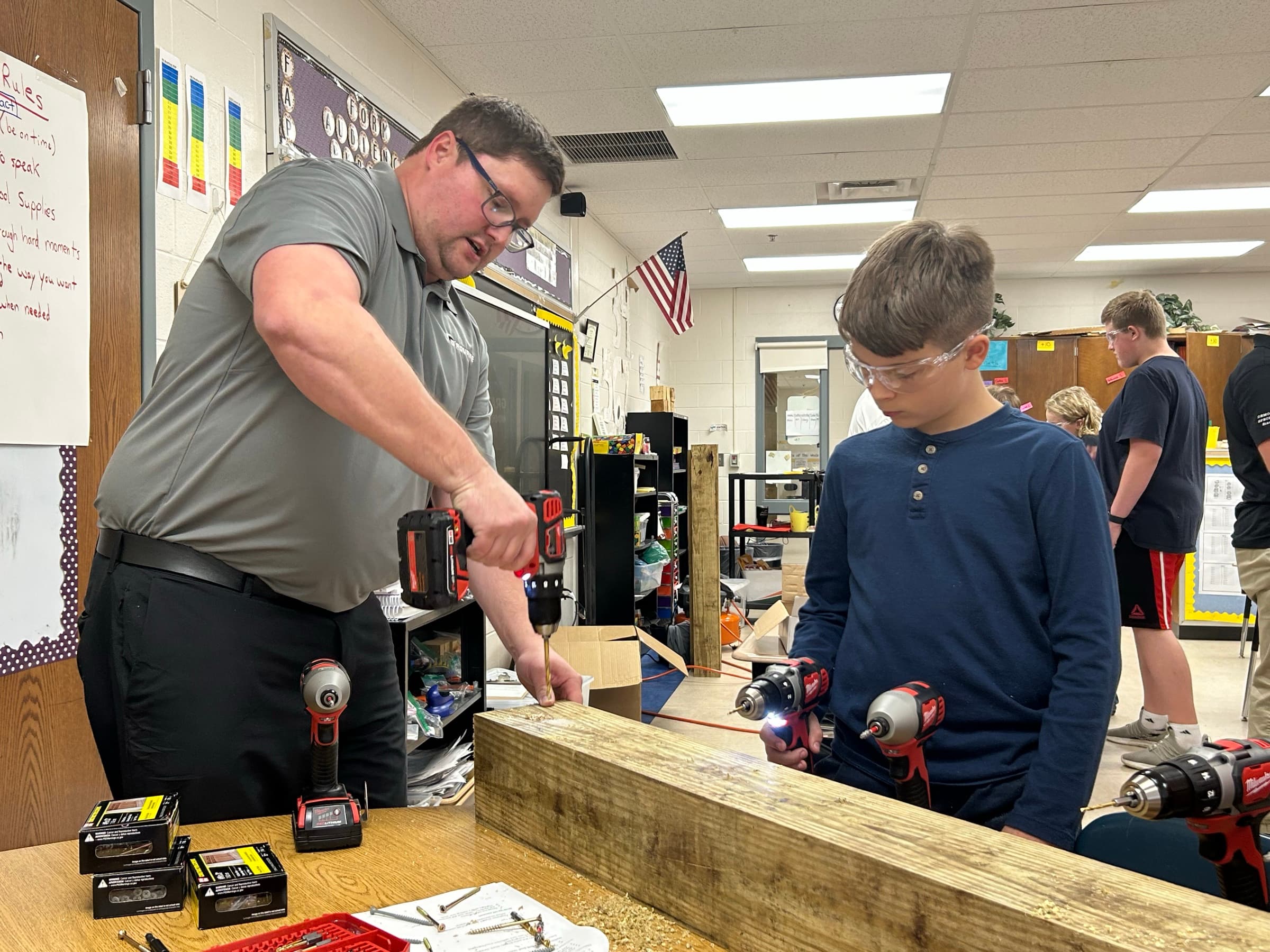 A mentor and a young adult working together in a Northern Kentucky trades setting