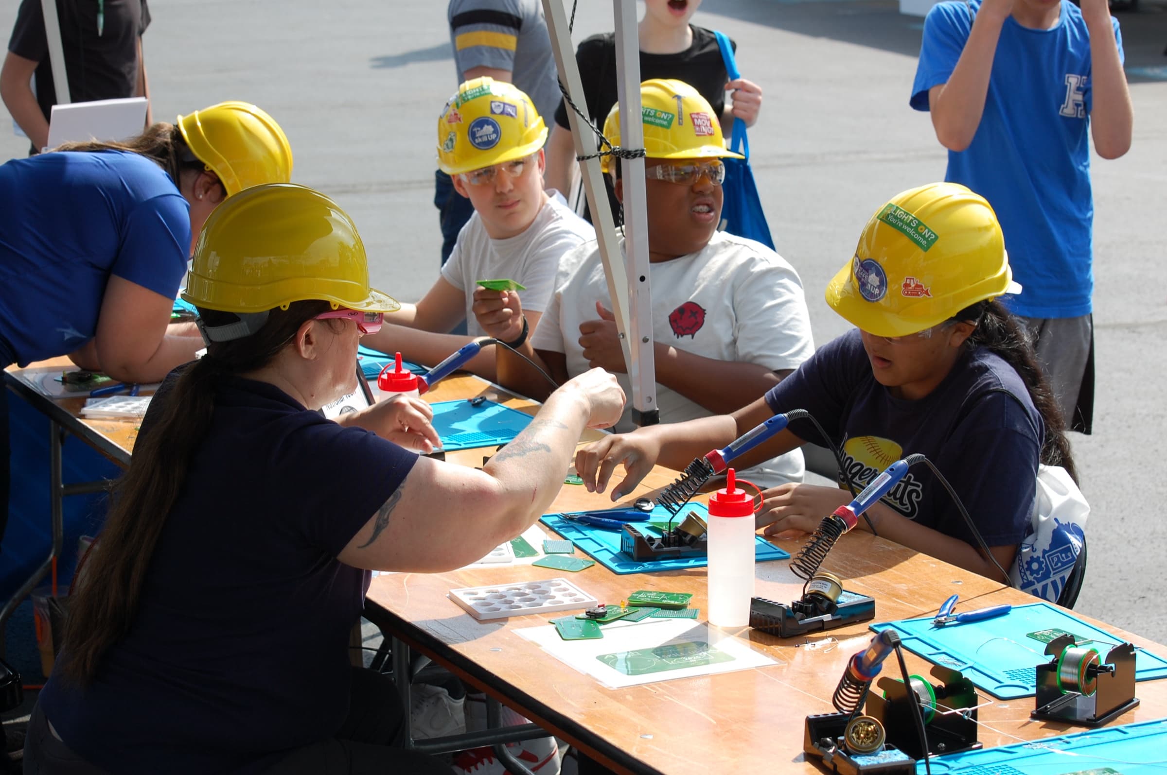 Middle school students using power tools during a hands-on TradesNKY BUILD lesson
